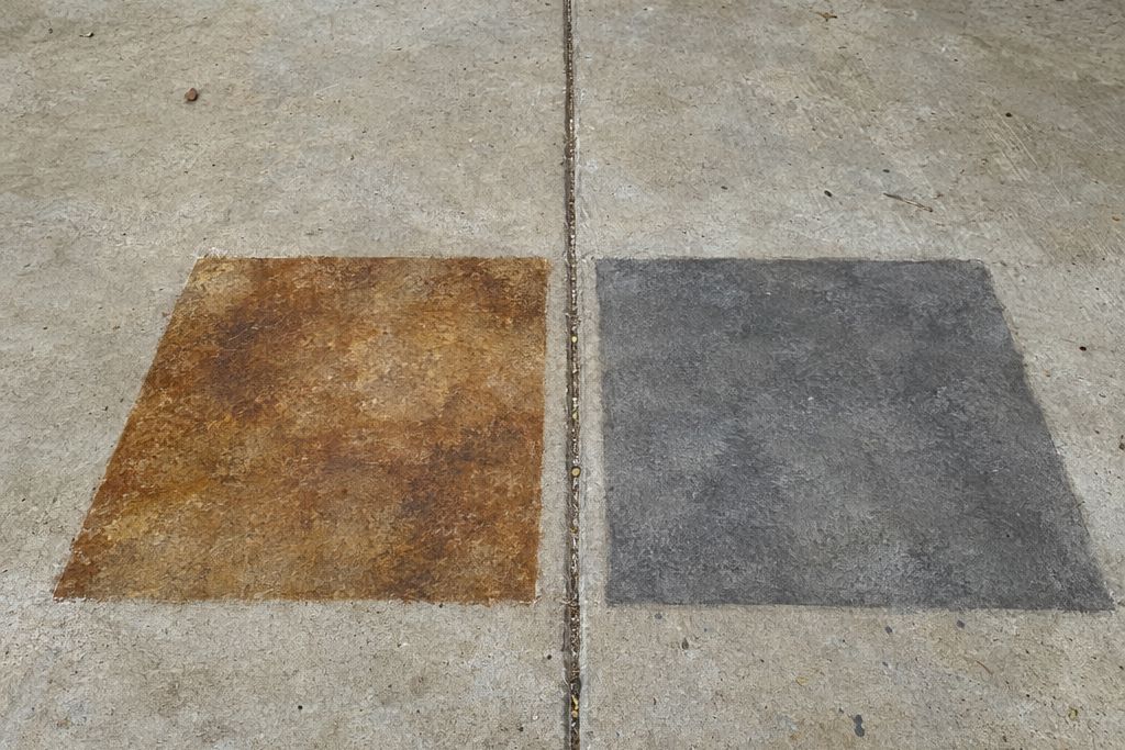 Two sample areas on a concrete floor: a mottled brown acid-stained square beside an even gray water-based stained square